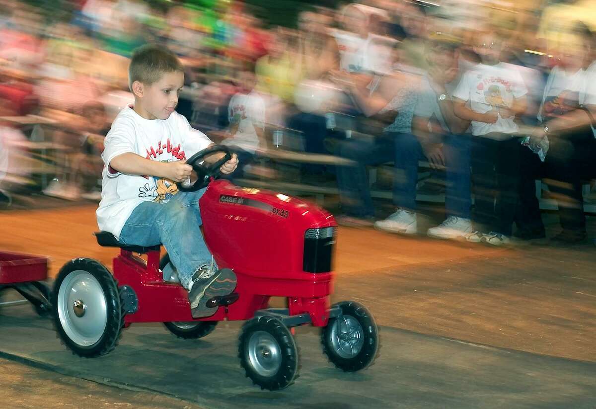 2. Kids Pedal Tractor Pull As crowds cheer them on, kids 4 to 12 can test their strength by riding a pedal tractor specially modified so that the further they travel, the more difficult it becomes. Daily, Family Fair.