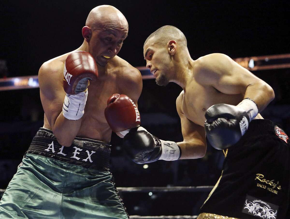 Alejandro Moreno (left) and Javier Rodriguez exchange punches during their super bantamweight bout part of the Premier Boxing Champions card on Dec. 12, 2015 at the AT&T Center. Rodriguez won by unanimous decision.