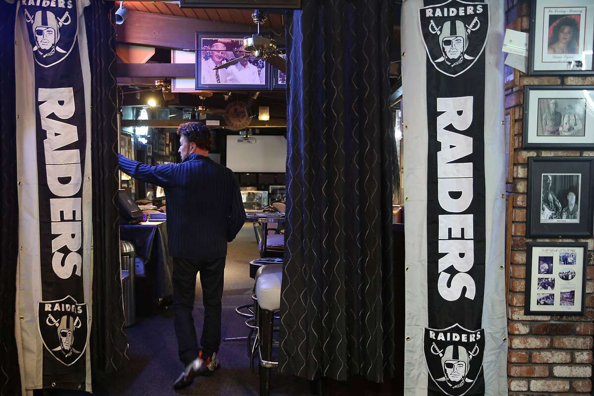 Ricky Ricardo, the business owner, walks inside Ricky's Sports Theatre and Grill on Thursday, Jan. 19, 2017 in San Leandro, Calif.