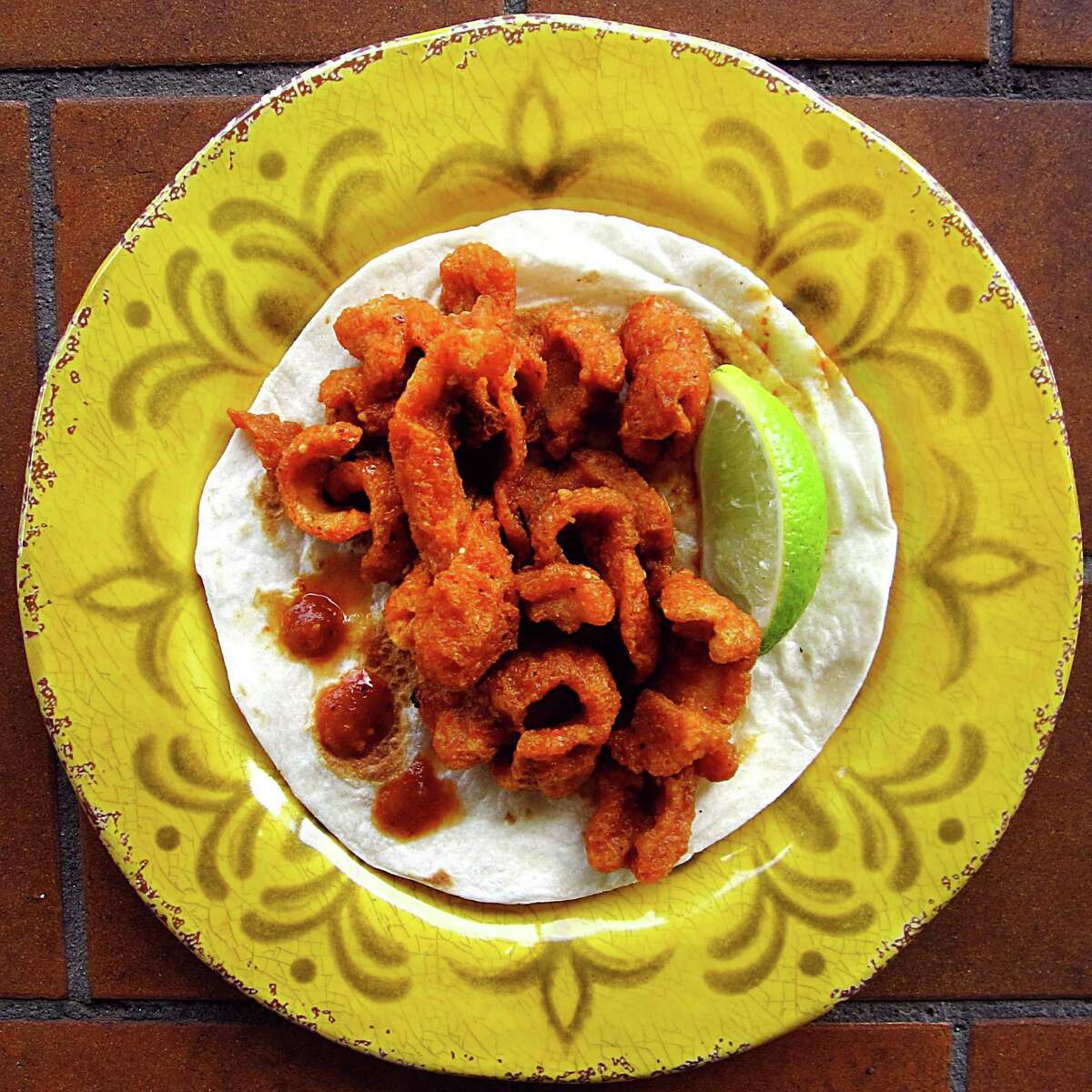 A chicharrones en salsa roja taco from El Buen Gusto Mexican Cafe on Tezel Road is our Tacof of the Week for Week 3 of 365 Days of Tacos.