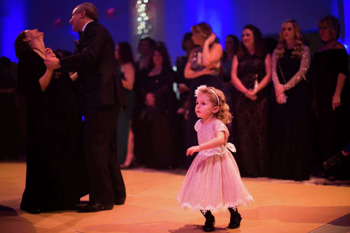 Adaleigh Ross, 2, dances ﻿at the 2017 Black Tie and Boots Presidential Inauguration Ball in Oxen Hill, Md.