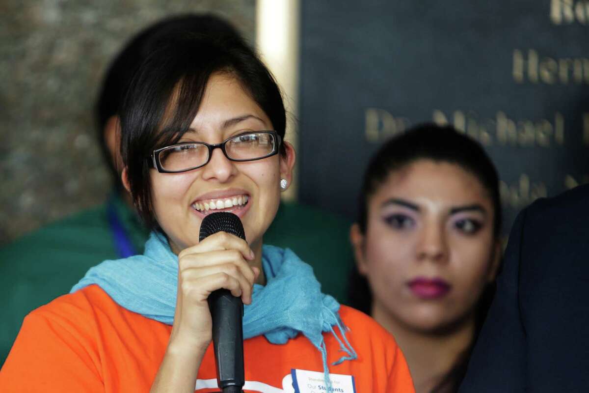 Carolina Ramirez urges her support for a resolution proposed by the Houston Community College Board of Trustees that would protect DACA recipients and other students during a rally outside of the college's downtown building before the board of trustees meeting, Jan. 19, 2017, in Houston. The board voted Thursday to pass a resolution pledging support to undocumented students like those who have obtained temporary status through the DACA program. ( Mark Mulligan / Houston Chronicle )