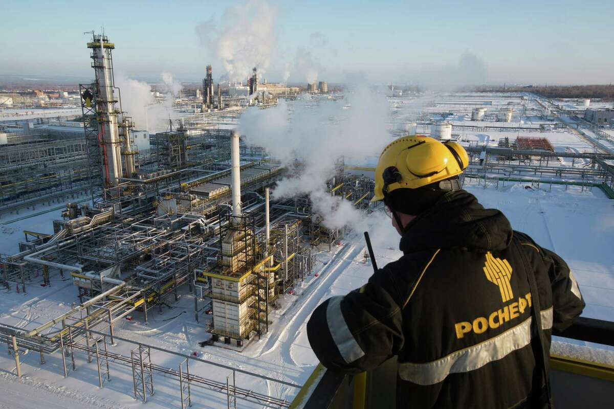 A worker overlooks a unit of Russia's Novokuibyshevsk oil refinery. Russia was among the nations that agreed to trim their oil production.