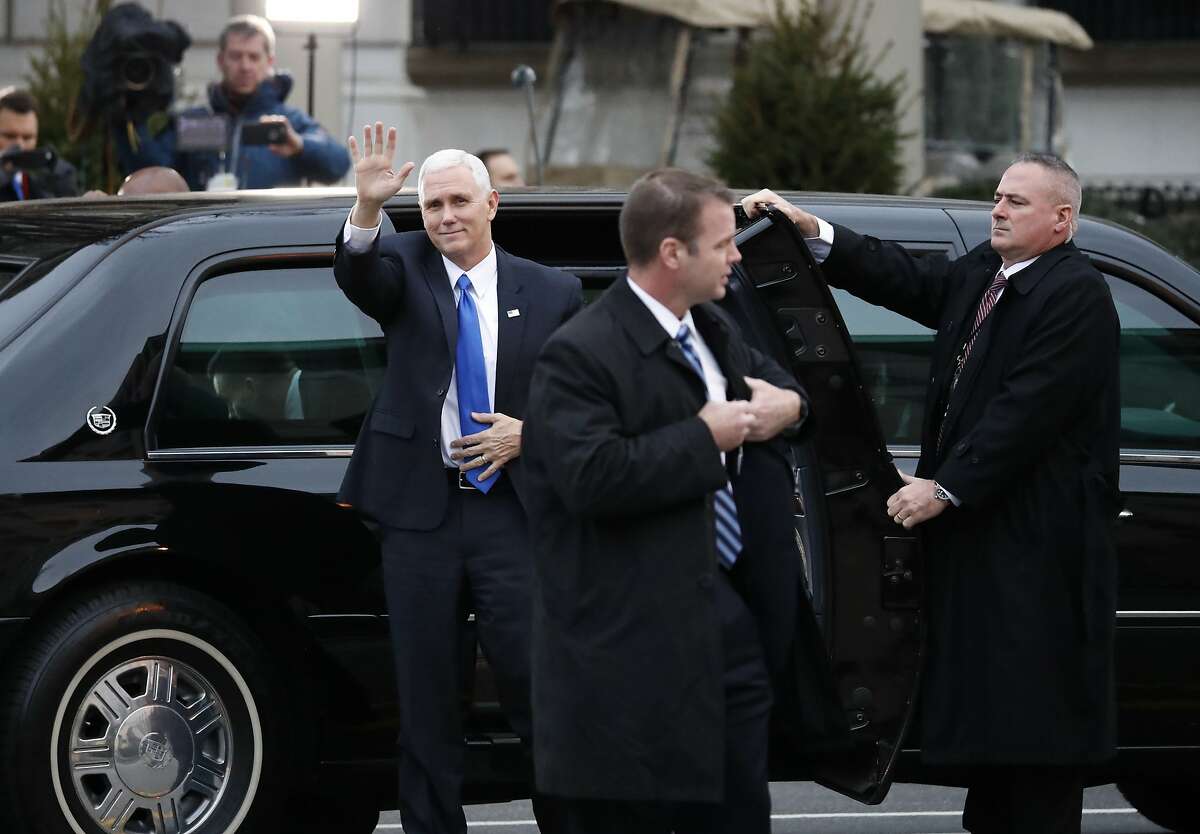 Vice President-elect Mike Pence waves as he arrives for church service at St. John's Episcopal Church across from the White House in Washington, Friday, Jan. 20, 2017, on Donald Trump's inauguration day. (AP Photo/Alex Brandon)