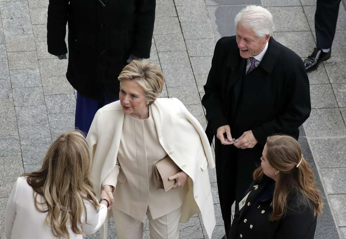 Former US President Bill Clinton and former Secretary of State Hillary Clinton arrive near the east front steps of the Capitol Building before President-elect Donald Trump is sworn in at the 58th Presidential Inauguration on Capitol Hill in Washington, D. on January 20, 2017. Donald Trump took the first ceremonial steps before being sworn in as the 45th president of the United States Friday -- ushering in a new political era that has been cheered and feared in equal measure. / AFP PHOTO / POOL / John ANGELILLOJOHN ANGELILLO/AFP/Getty Images