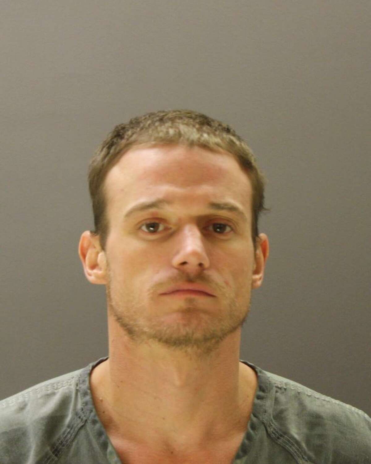 Police Man high on meth attacks uncle with power saw, hammer on roof