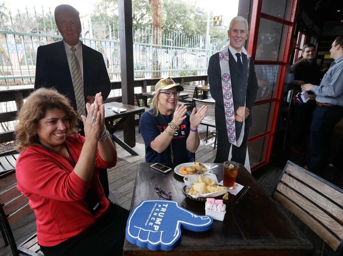 Cynthia Resendez , left, and Rachelle Pierce applaud during the GOP Inaugural Watch Party at Ninfa's, 2704 Navigation Blvd., Friday, Jan. 20, 2017.