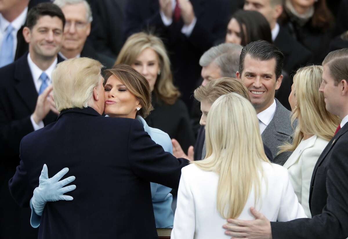 Melania Trump congratulates U.S. President Donald Trump (L) after he took the oath of office, on the West Front of the U.S. Capitol on January 20, 2017 in Washington, DC. In today's inauguration ceremony Donald J. Trump becomes the 45th president of the United States. (Photo by Chip Somodevilla/Getty Images)