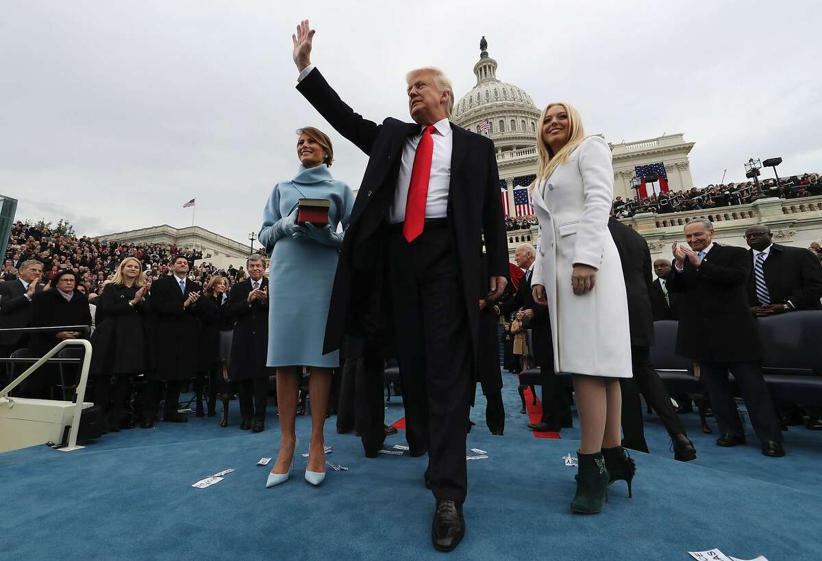 US President Donald Trump acknowledges the audience after taking the oath of office as his wife Melania (L) and daughter Tiffany watch during inauguration ceremonies swearing in Trump as the 45th president of the United States on the West front of the US Capitol in Washington, DC, January 20, 2017. Donald Trump was sworn in as the 45th president of the United States Friday -- ushering in a new political era that has been cheered and feared in equal measure. / AFP PHOTO / POOL / JIM BOURGJIM BOURG/AFP/Getty Images