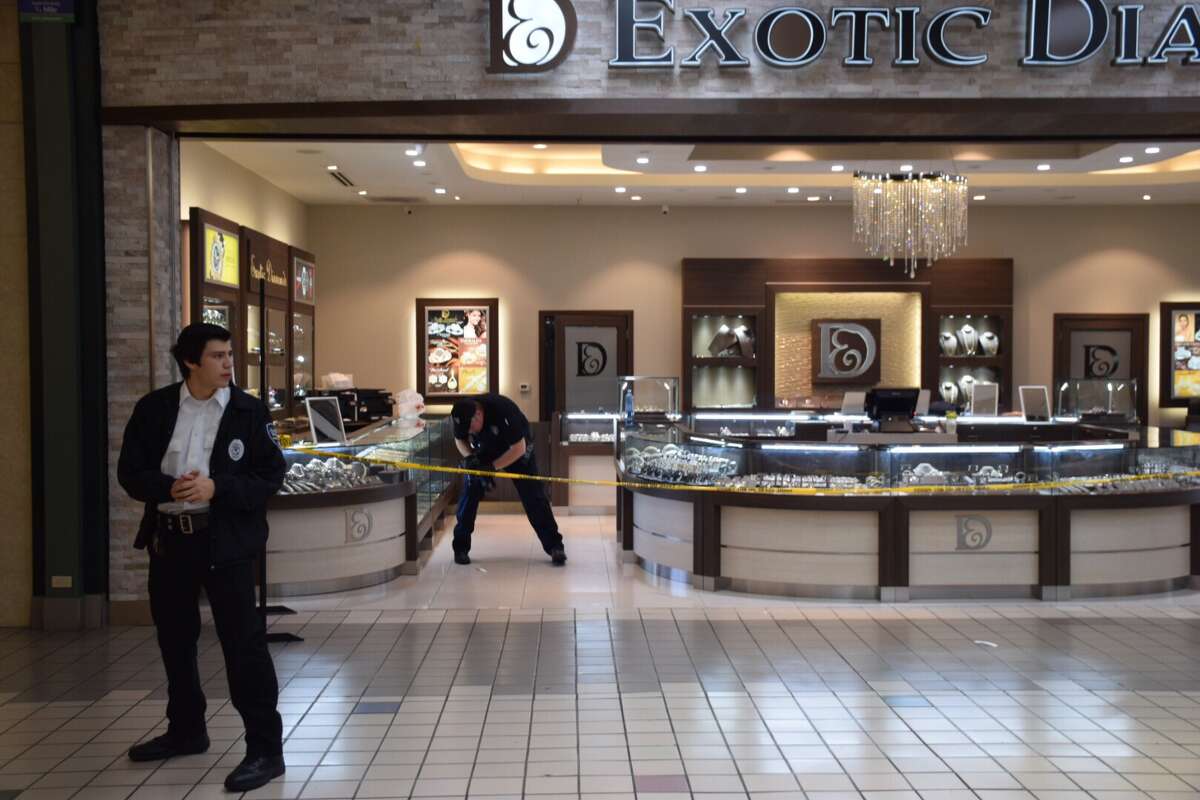 Surveillance photos show jewelry store armed robbery suspects at South
