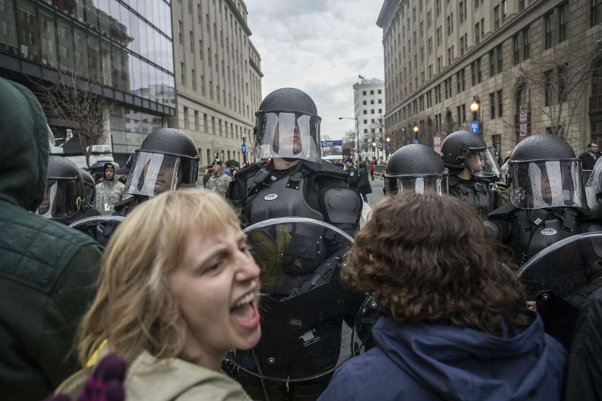 Riot police hold a line against protesters attempting to block an entrance to the National Mall as they rally against the inauguration of Donald Trump as the nation�s 45th president, in Washington, Jan. 20, 2017. (Victor J. Blue/The New York Times)
