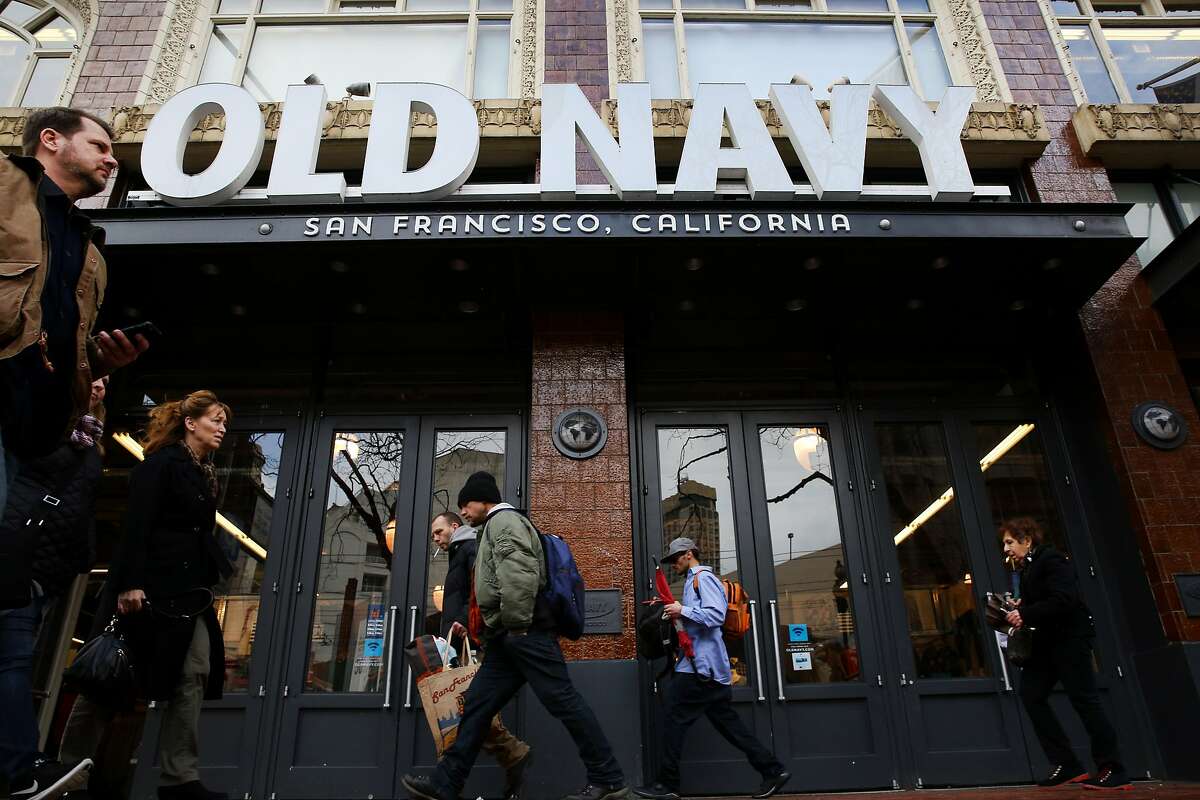 People walk past the Old Navy on Market Street on Friday, Jan. 20, 2017 in San Francisco, Calif. Congress is considering changes to the tax system that will make companies that import goods pay more taxes. Consumers might then face higher prices. Gap, which owns Old Navy, makes a lot of its clothing overseas.