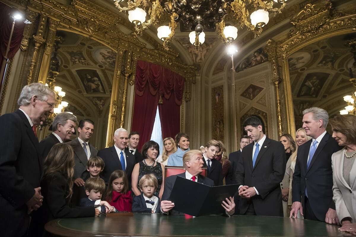 President Donald Trump is joined by the Congressional leadership and his family as he formally signs his cabinet nominations into law, in the President's Room of the Senate, at the Capitol in Washington, January 20, 2017. pictured are Senate Majority Leader Mitch McConnell,(R-Ky), Senate Minority Leader Chuck Schumer (D-NY), and Sen. Roy Blunt, (R-Mo) Speaker of the House Paul Ryan, (R-Wis) Majority Leader Kevin McCarthy, (R-CA), House Minority Leader Nancy Pelosi,(D-CA) Vice President Mike Pence wife Karen Pence, Donald Trump, wife Melania Trump, son Barron Trump, Ivanka Trump, her husband Jared Kushner and children Arabella, Joseph and Theodore, Donald Trump Jr., his wife Vanessa Haydon, children Kai and Chloe, Donald, Tristan and Spencer, Eric Trump,wife Lara Yunask, Tiffany Trump, Chief of Staff Reince Priebus and Donald McGahn, White House counsel (Photo by J. Scott Applewhite - Pool/Getty Images)