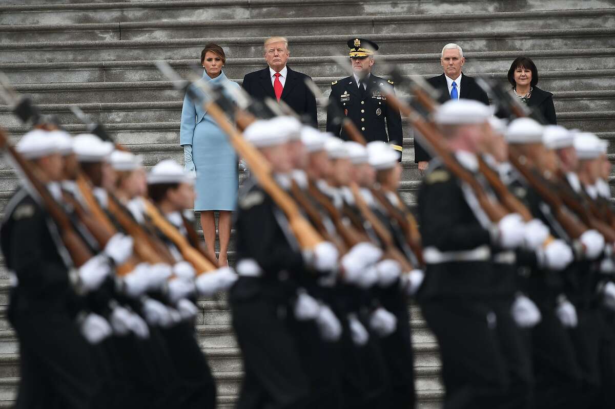 L-R: First Lady of the US Melania Trump, President Donald Trump, US Army Maj. General Bradley Becker, Vice President Mike Pence and Karen Pence look on at the start of the inaugural parade at the US Capitol January 20, 1017 in Washington, DC.