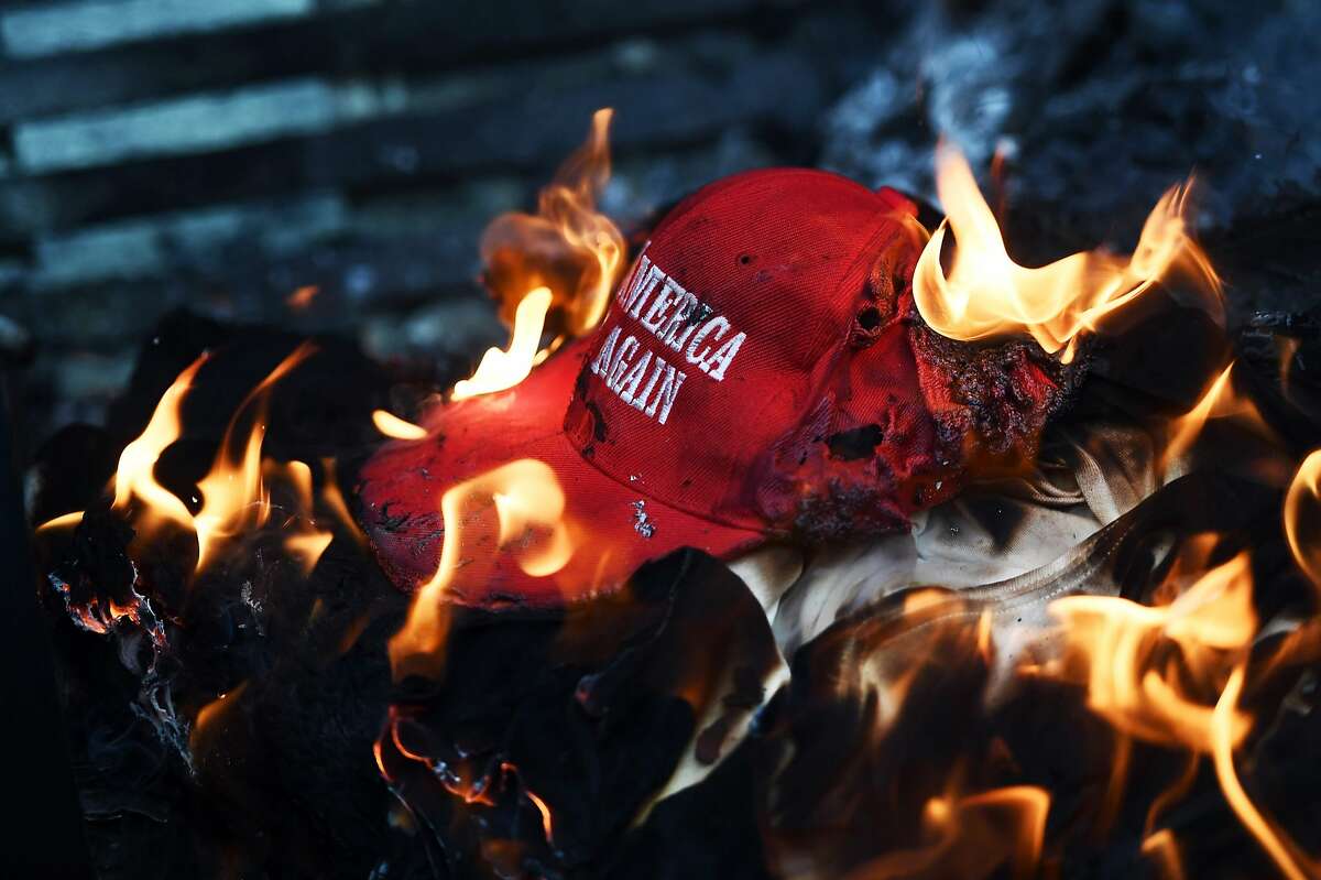 Hat Burning Some Trump supporters burned their "Make America Great Again" hats after Democratic leaders in Congress announced that they had reached an agreement on Deferred Action for Childhood Arrivals with Trump, Buzzfeed reported in September 2016. Pictured: Anti-Trump demonstrator set a "Make America Great Again" hat on fire in Washington, DC, on January 20, 2107. AFP PHOTO / Jewel SAMADJEWEL SAMAD/AFP/Getty Images