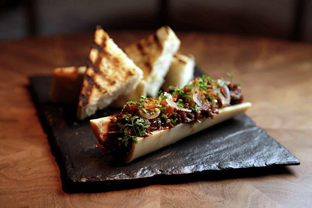 Bone marrow and oxtail served with brioche toast, stone fruit mostarda and pickled shallot