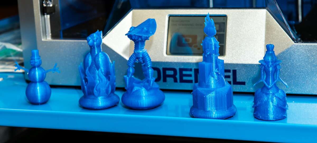 3-D printed chess pieces are displayed in front of a 3-D printer on Friday, January 20, 2017 at Alexander High School. The pieces were created by the "Chess, Anyone?" team.