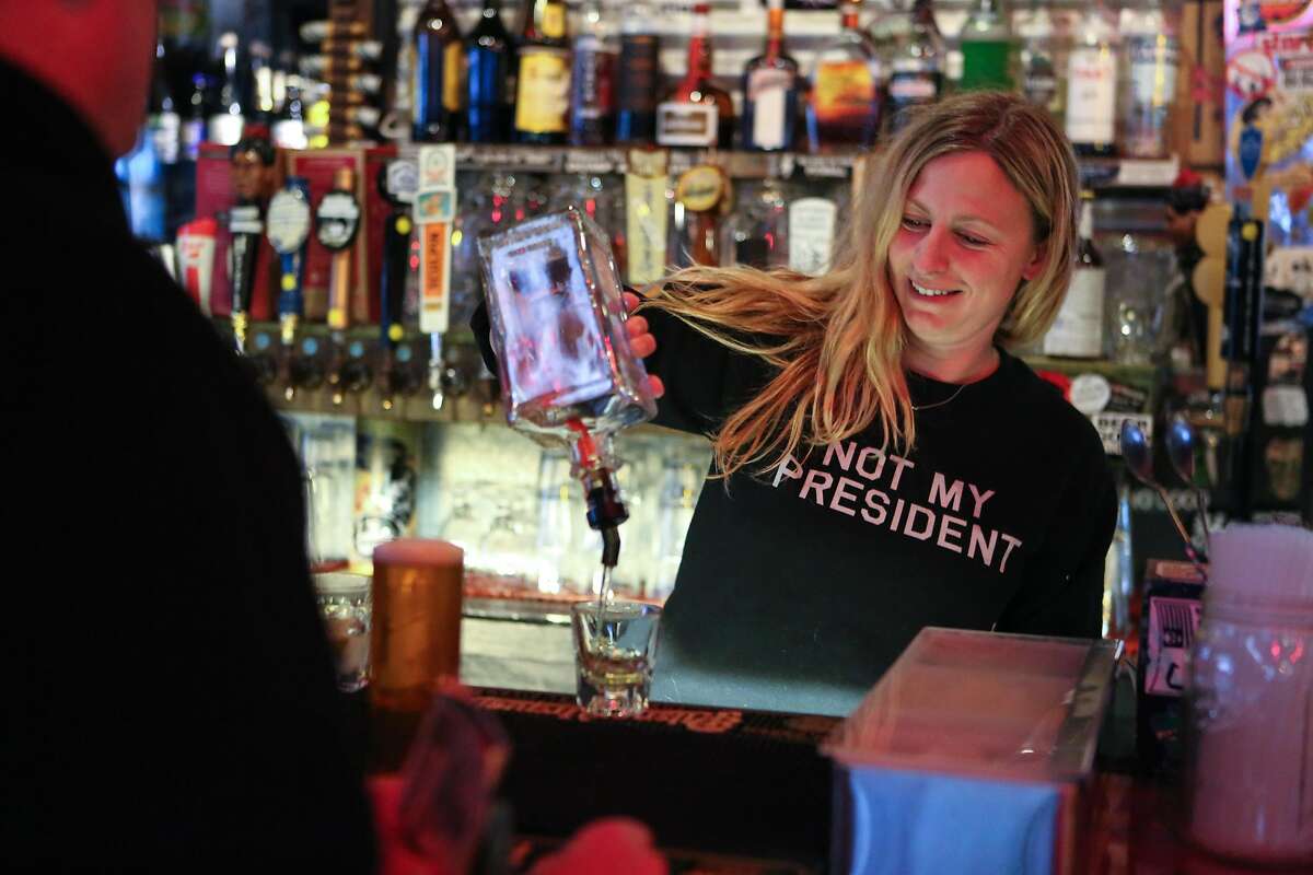 Bartender Meredith Newsom, wears an anti-trump shirt at Zeitgeist on Friday, January 20, 2017 in San Francisco, Calif.