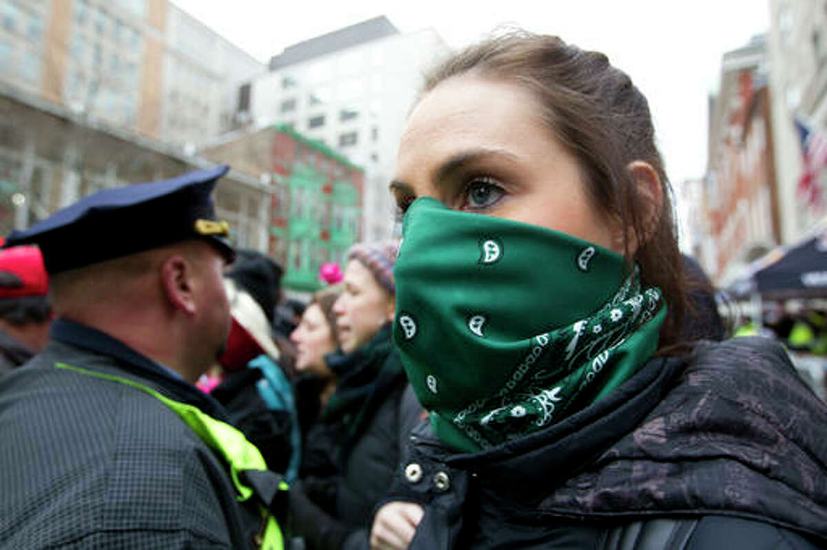 Police push back demonstrators attempting to block people entering a security checkpoint, Friday, Jan. 20, 2017, during President Donald Trump's inauguration in Washington. ( AP Photo/Jose Luis Magana)
