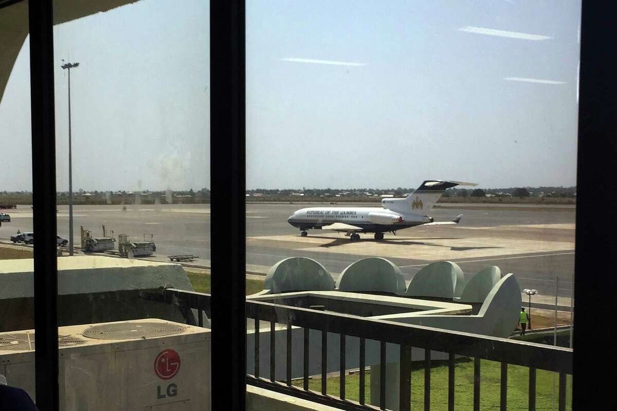 A Gambian Presidential aircraft is parked on the tarmac of Baunjul'a airport, in Gambia, Friday Jan. 20, 2016. The leaders of Guinea and Mauritania have arrived in Gambia's capital in a last-ditch diplomatic effort to get defeated President Yahya Jammeh to cede power to Adama Barrow who was sworn in as Gambian President Thursday. (AP Photo/Jerome Delay)