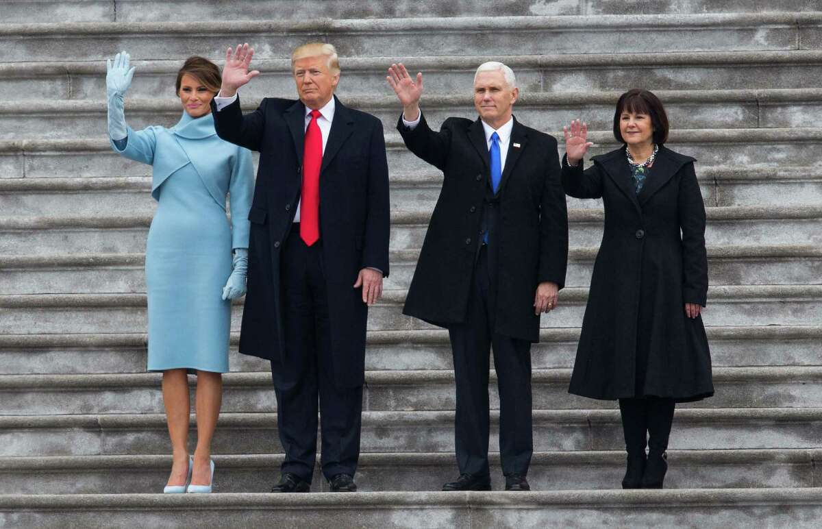 President Donald Trump and first lady Melania Trump with Vice President Mike Pence and Karen Pence wave goodbye to former President Barack Obama and Michelle Obama Friday. ﻿
