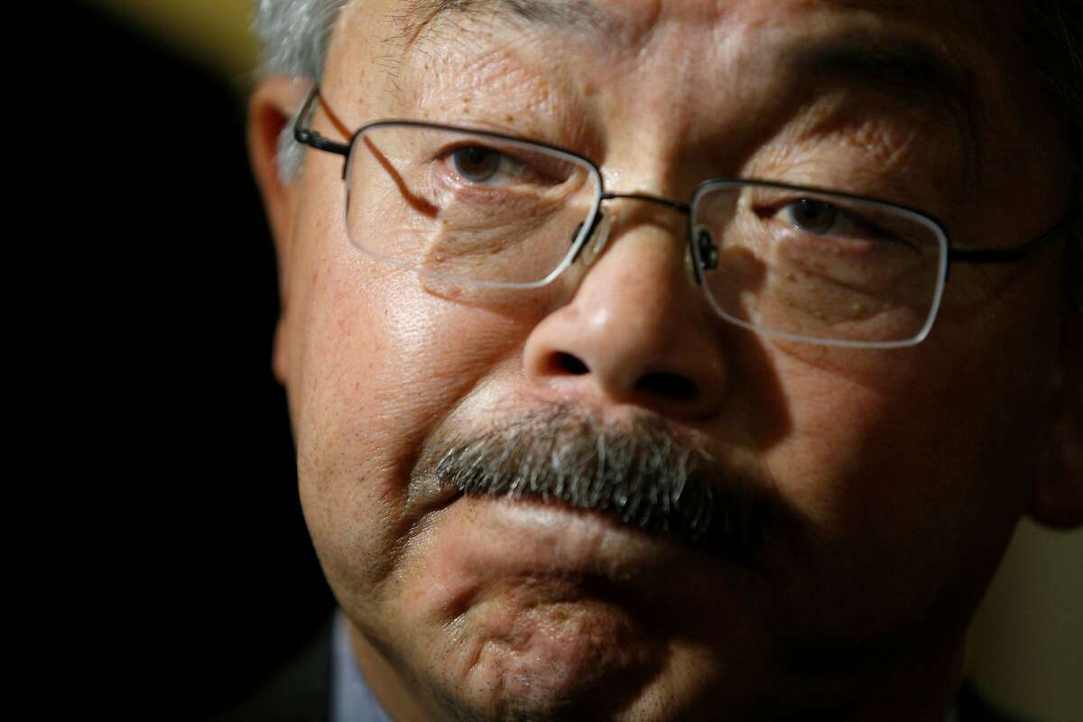 Mayor Ed Lee answers questions from news reporters about its sanctuary city policy, as he exits a Board of Supervisors meeting at City Hall, on Tuesday, Nov. 15, 2016 in San Francisco, Calif.