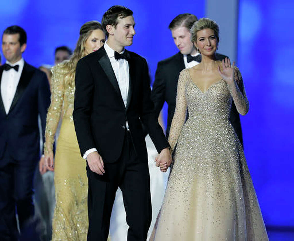 Jared Kushner and Ivanka Trump celebrate with the crowd at the Freedom Ball in Washington, on Friday, Jan. 20, 2017, at the Washington Convention Center during the 58th presidential inauguration. Behind them are Eric Trump and his wife Lara Yunaska and at far left is Donald Trump Jr.. (AP Photo/Mark Tenally)