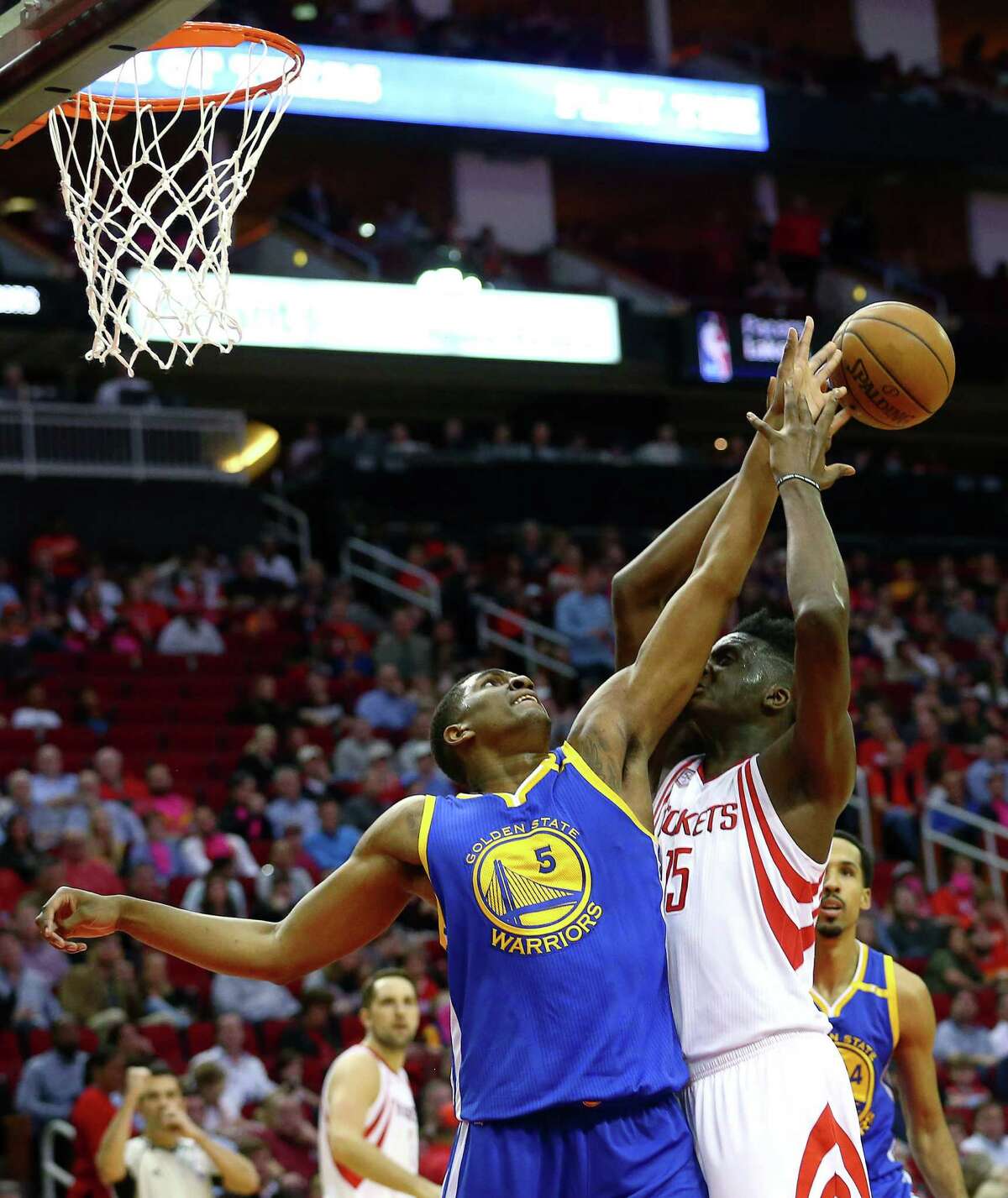 Golden State Warriors forward Kevon Looney (5) blocks a layup by Houston Rockets center Clint Capela (15) during the second quarter of an NBA game at the Toyota Center Friday, Jan. 20, 2017, in Houston. ( Jon Shapley / Houston Chronicle )