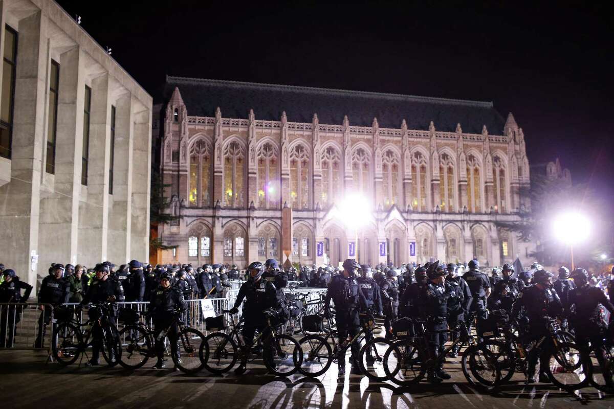 A heavy police presence was visible outside Kane Hall on Friday, Jan. 20, 2017 as people protested Breitbart.com editor Milo Yiannopoulos who was speaking inside. The security costs were later said to run more than $75,000. 