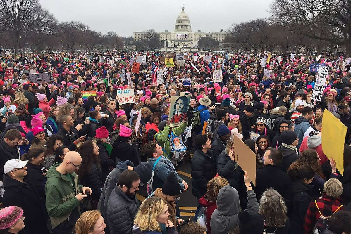 Demonstrators protest on the National Mall in Washington, DC, for the Women's march on January 21, 2017. Hundreds of thousands of protesters spearheaded by women's rights groups demonstrated across the US to send a defiant message to US President Donald Trump. / AFP PHOTO / Andrew CABALLERO-REYNOLDSANDREW CABALLERO-REYNOLDS/AFP/Getty Images