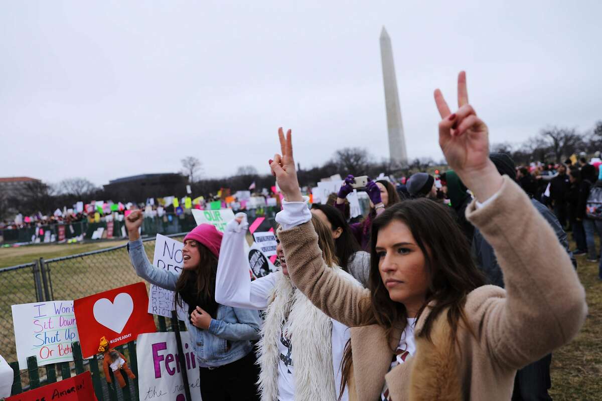 Protesters gather on the Ellipse ned the White House in Washington, DC on January 21, 2017. Hundreds of thousands of protesters spearheaded by women's rights groups demonstrated across the US to send a defiant message to US President Donald Trump. / AFP PHOTO / DOMINICK REUTERDOMINICK REUTER/AFP/Getty Images