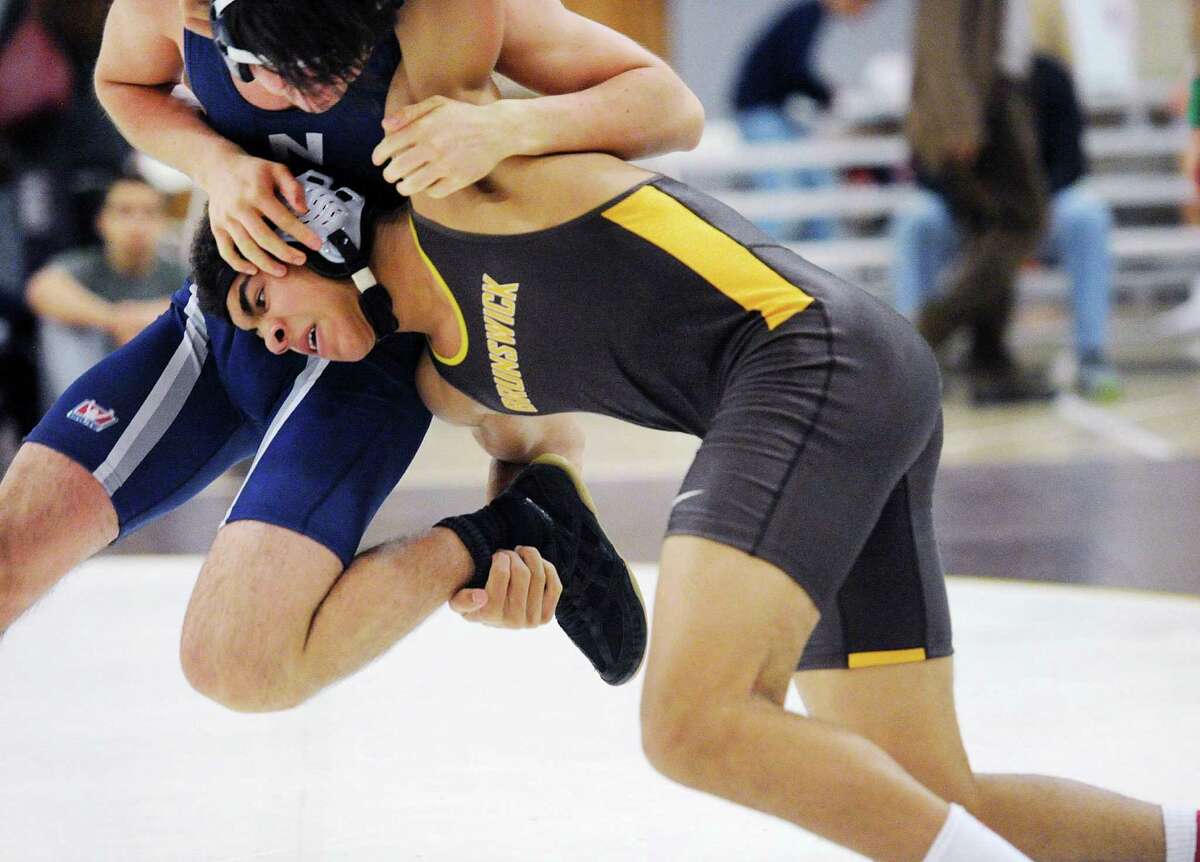 At foreground, Timmy Saunders of Brunswick (in brown) takes down Ian Riley of Noble & Greenough in the 170 pound championship match that Saunders won by a pin during the Brunswick School Invitational Wrestling Tournament at the school in Greenwich, Conn., Saturday, Jan. 21, 2017.