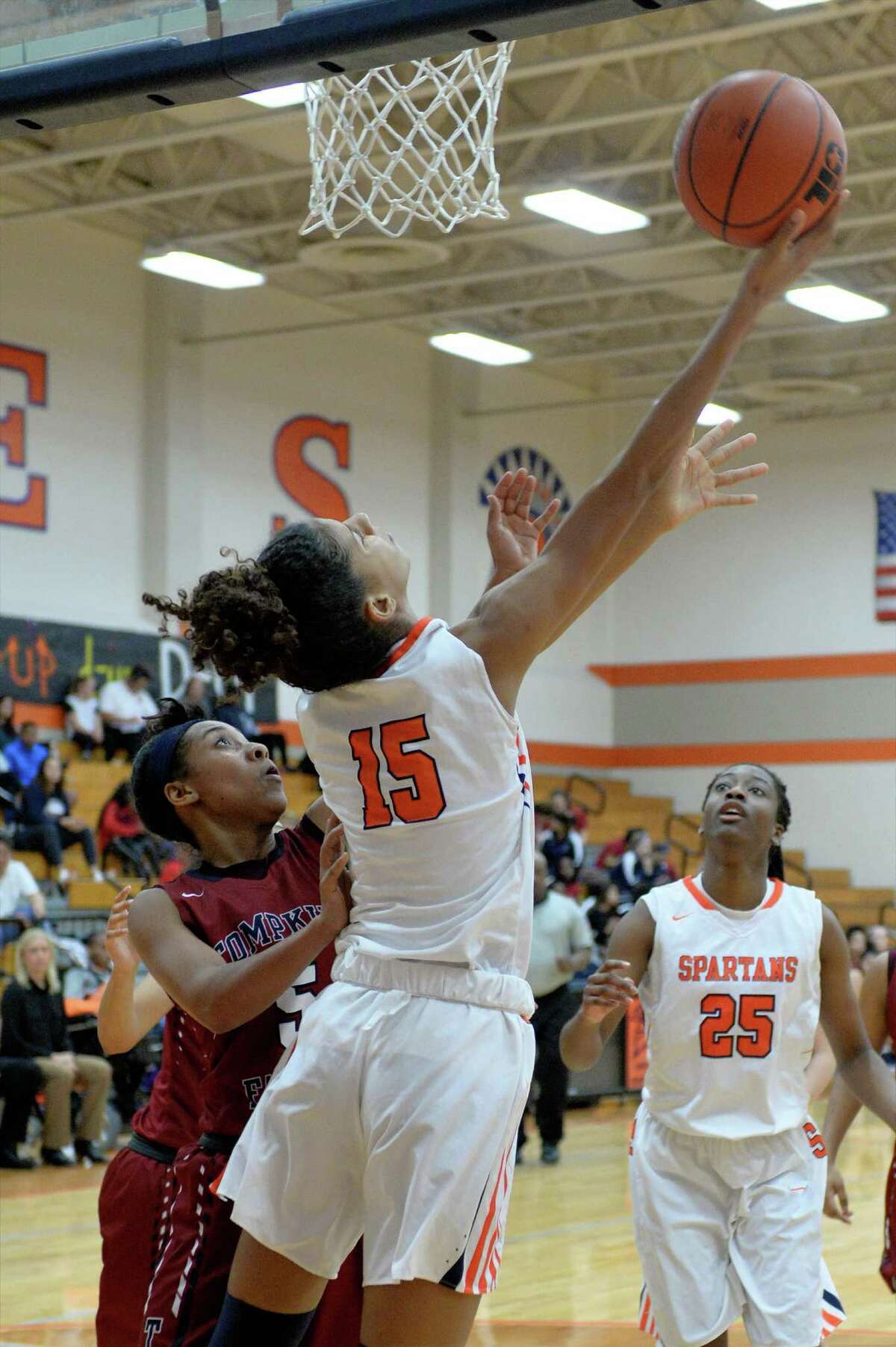 Priscilla Williams (15) of Seven Lakes attempts a reverse lay-up during the second half of a girls basketball game between the Seven Lakes Spartans and the Tompkins Falcons on Tuesday January 17, 2017 at Seven Lakes High School, Katy, TX.