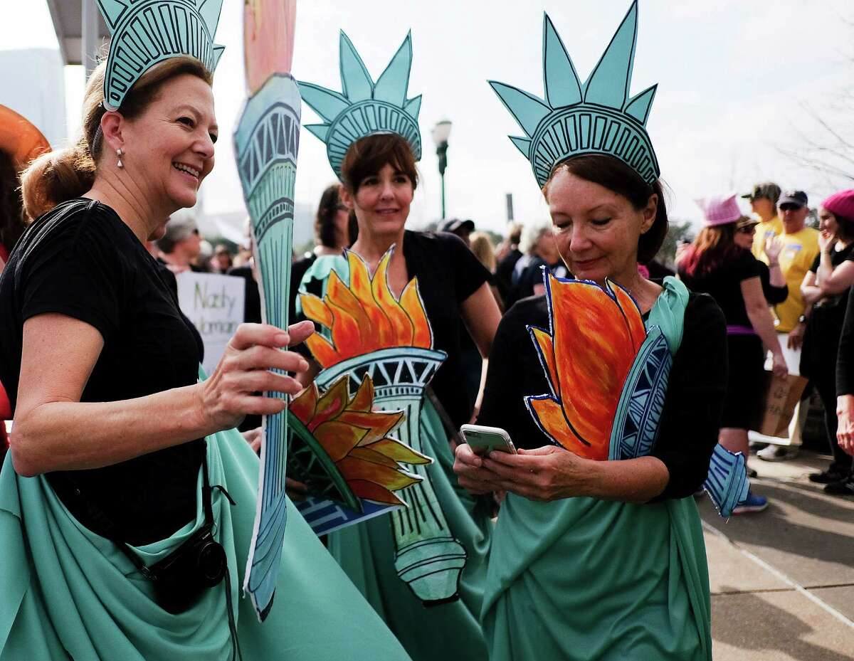 These women participating in the Houston march donned costumes of the Statue of Liberty.