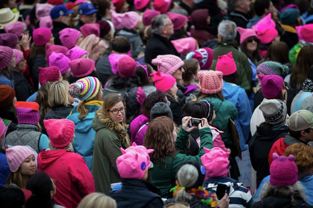 Protesters in Washington sport "pussycat" hats as a pointed reminder of one of President Donald Trump's notorious pronouncements about women.