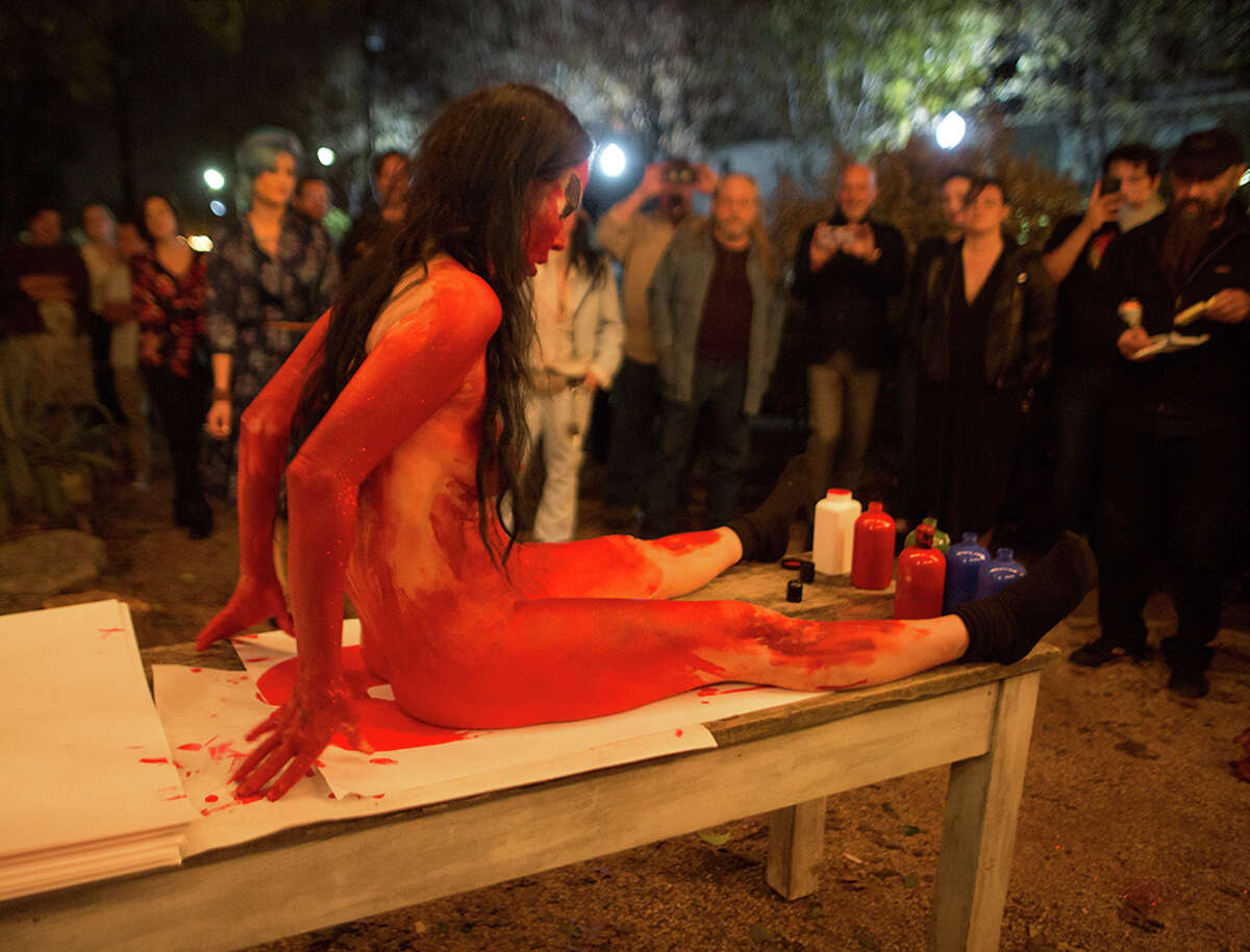 Artist Kembra Pfahler was at Sala Diaz Saturday, Jan. 22, 2017, to strip down, cover herself in paint, sit on paper and then sell the paper to people.
