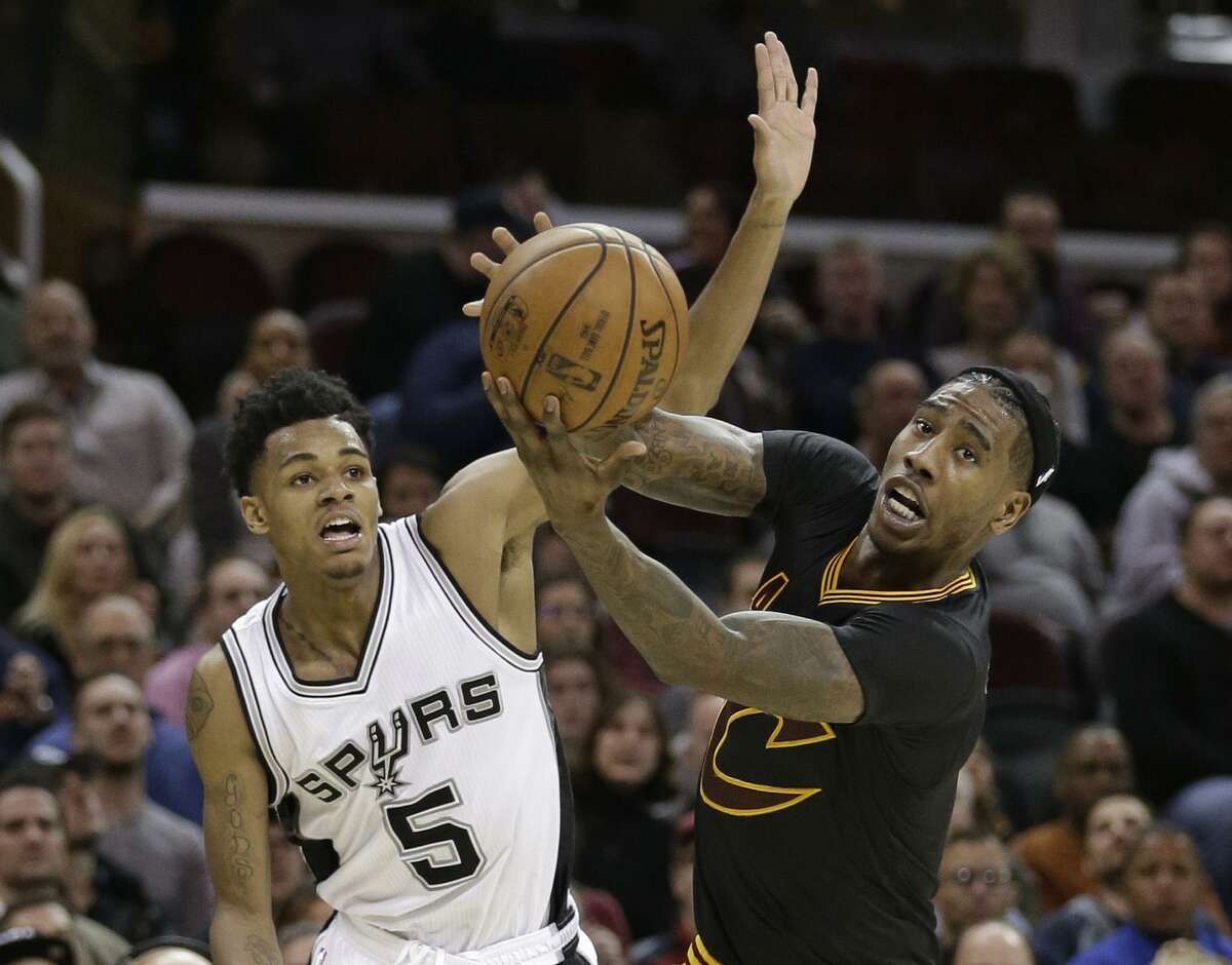 Rookie Dejounte Murray (left), starting in place of Tony Parker, had 14 points and six assists in the Spurs’ victory at Cleveland.