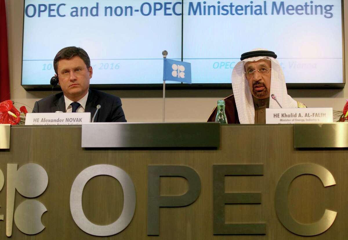 FILE - In this Saturday, Dec. 10, 2016 file photo, Russian Minister of Energy Alexander Novak, left, and Khalid Al-Falih, Minister of Energy, Industry and Mineral Resources of Saudi Arabia attend a news conference after a meeting of the Organization of the Petroleum Exporting Countries, OPEC, at their headquarters in Vienna, Austria. OPEC and key non-OPEC oil producers are near their target of taking 1.8 million barrels of crude a day off global markets less than two months after agreeing to do so in efforts to push up the price of crude, Russia's energy minister said Sunday, Jan. 22, 2017. Novak's upbeat comments to reporters came at the end of the first meeting of a joint OPEC-non-OPEC committee set up to monitor compliance to the Dec. 10 agreement. (AP Photo/Ronald Zak, FIle)