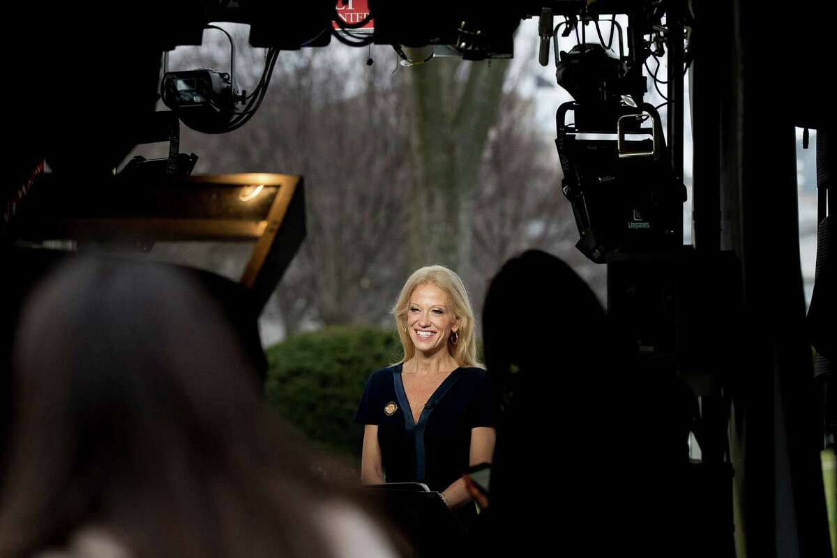 Trump adviser Kellyanne Conway gets ready to speak live on television outside the White House, Sunday, Jan. 22, 2017, in Washington. (AP Photo/Andrew Harnik)