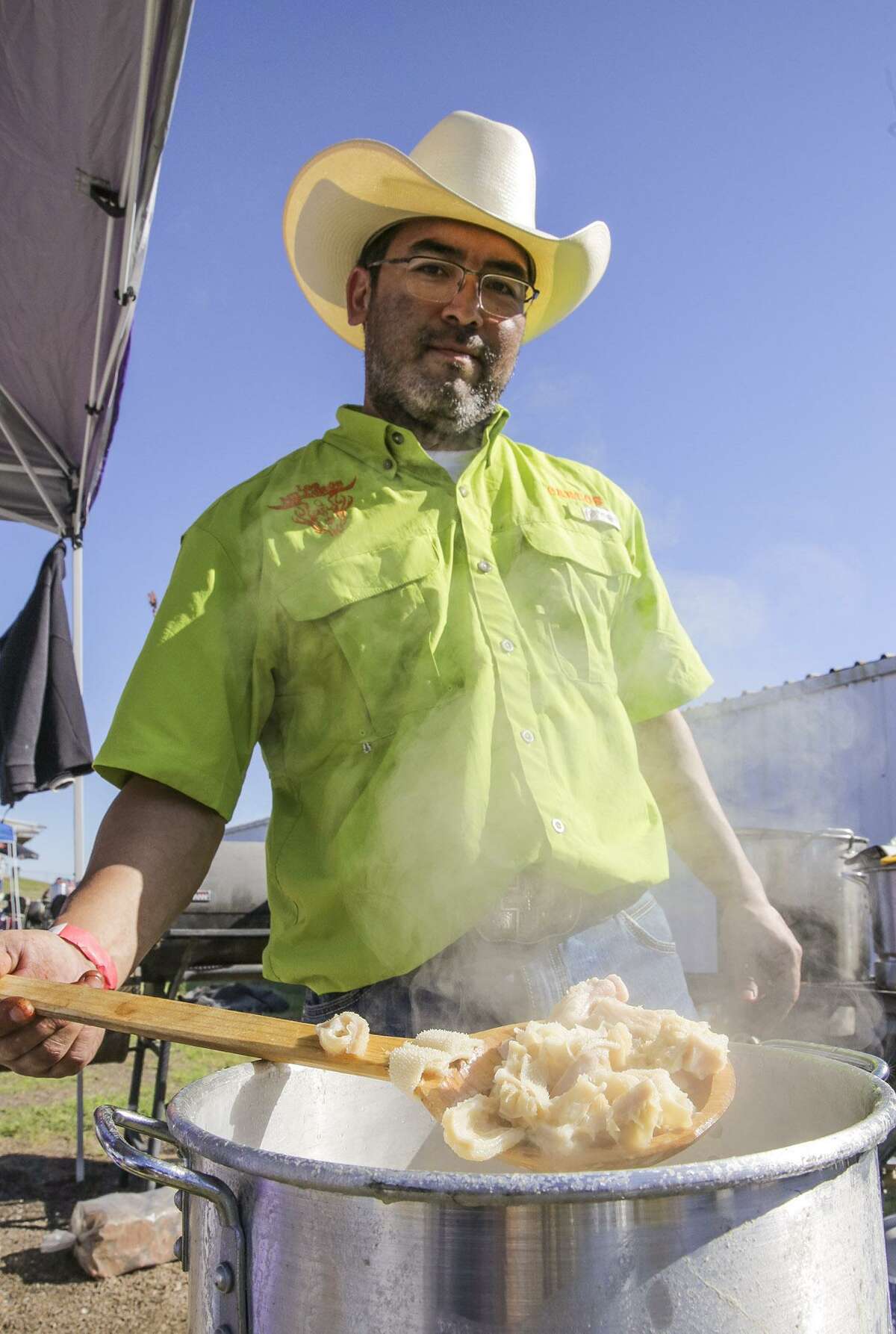 In this file photo, Carlos Enriquez of Los Milagros Q Crew showcases a spoonful of menudo during the 22nd Annual Crime Stoppers Menudo Bowl at LIFE Downs. 