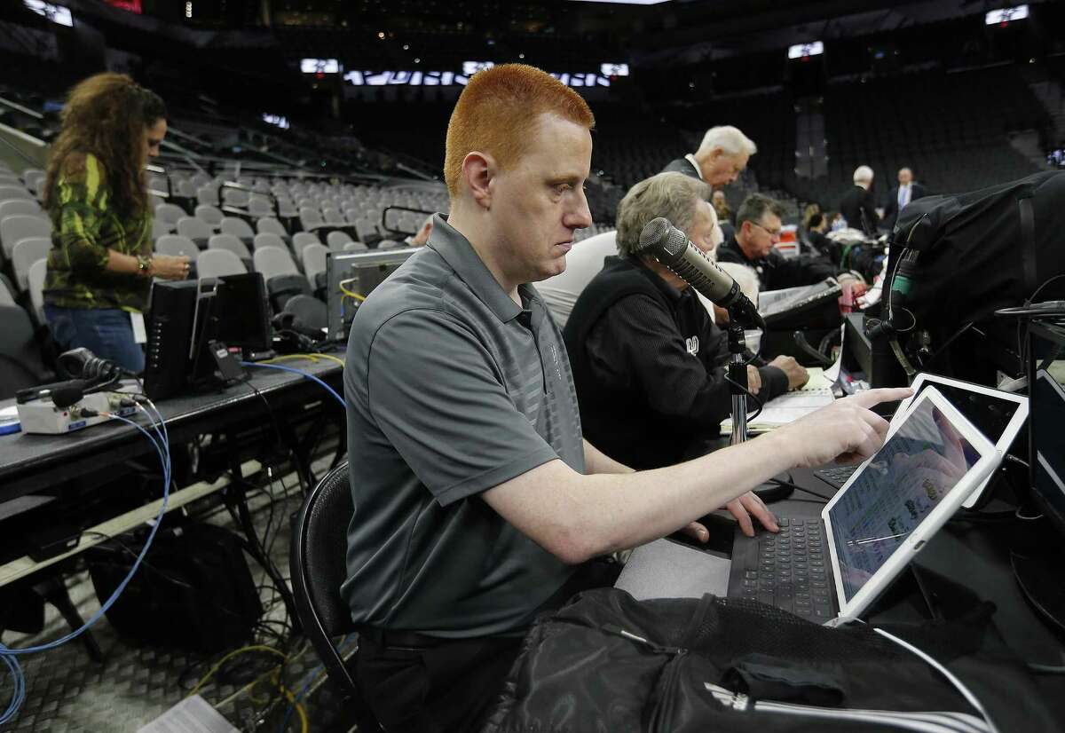 Spurs announcer Jonathan Sanford gets ready for work before the game against the Minnesota Timberwolves at the AT&T Center on Jan. 17, 2017.