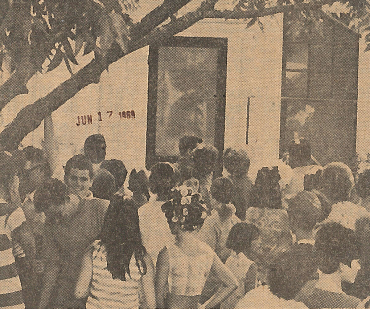 "Persons from among all age gropus press close to the back screen door Monday of the C.P. Bass home, 816 Ave. C in Port Neches, to see a likeness of the head profile of Jesus Christ. The image's chin is just above the head of a youth in the center. The hair of the likeness is long and curves downward to the left." Enterprise staff photo by John Snell. Published June 17, 1969 The appearance of Jesus Christ's profile on a screen door at 816 Ave. C, Port Neches, in 1969, brought thousands of visitors to Mid-County.