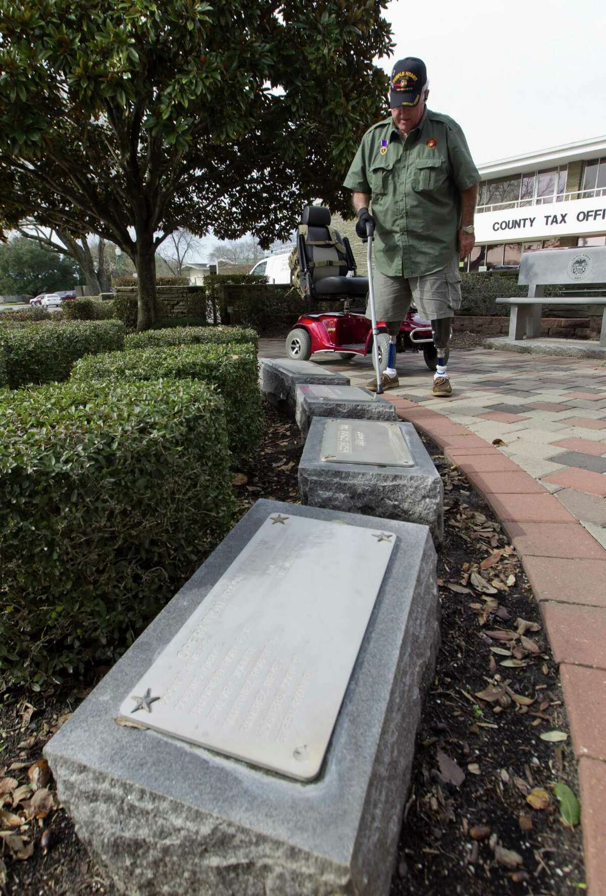 Retired United States Marine Corps Cpl. Jimmie Edwards III looks over former classmates lost serving in Vietnam during a visit to Montgomery County War Memorial Park Friday, Jan. 20, 2017, in Conroe.
