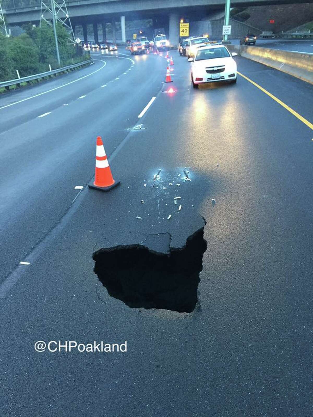A sinkhole on southbound SR-13 just north of Broadway Terrace in Oakland that opened up after rains on Jan. 23, 2017.