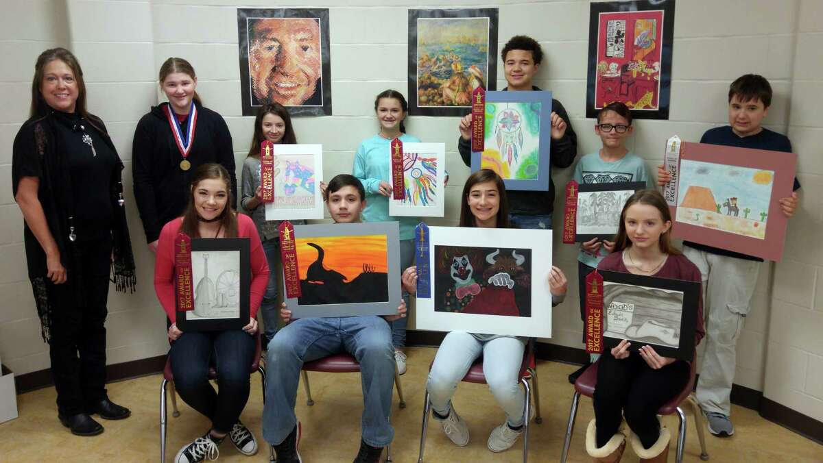 Little Cypress Junior High art students winning ribbons and awards during the Houston Livestock Show and Rodeo are (front row left to right): Allyson Campbell, Justin Nealy, Braylee Freeman, and Grace Gossard. On the back row from left are teacher Donna Cole, Gold Medal Winner Raeleigh Underwood, Erika Aviles, Lauren Tinsley, KJ Derouen, Jonah Courtier, and Colby Ortego.
