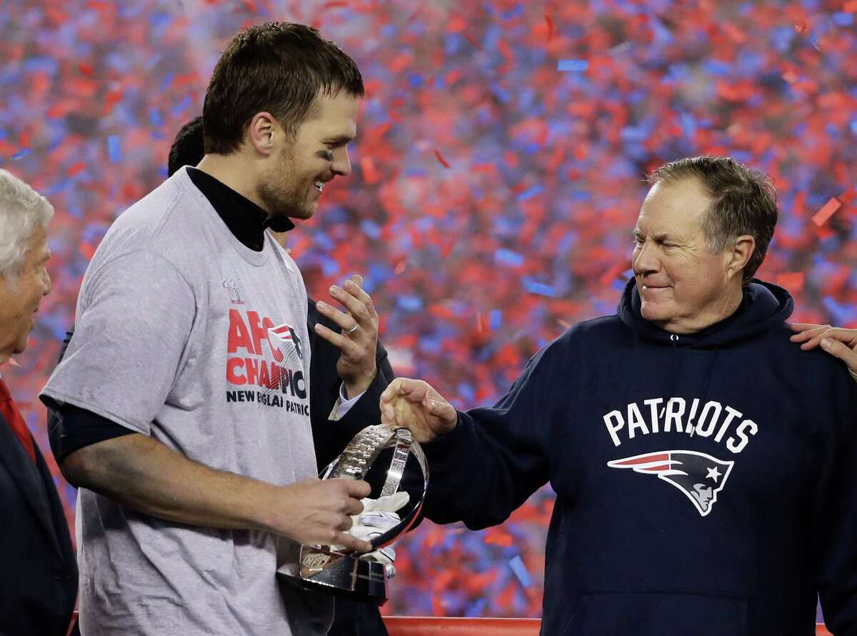 New England Patriots quarterback Tom Brady, left, holds the AFC Championship trophyÂ as he celebrates with head coach Bill Belichick after the AFC championship NFL football game, Sunday, Jan. 22, 2017, in Foxborough, Mass. The Patriots defeated the the Pittsburgh Steelers 36-17 to advance to the Super Bowl.Â (AP Photo/Matt Slocum)