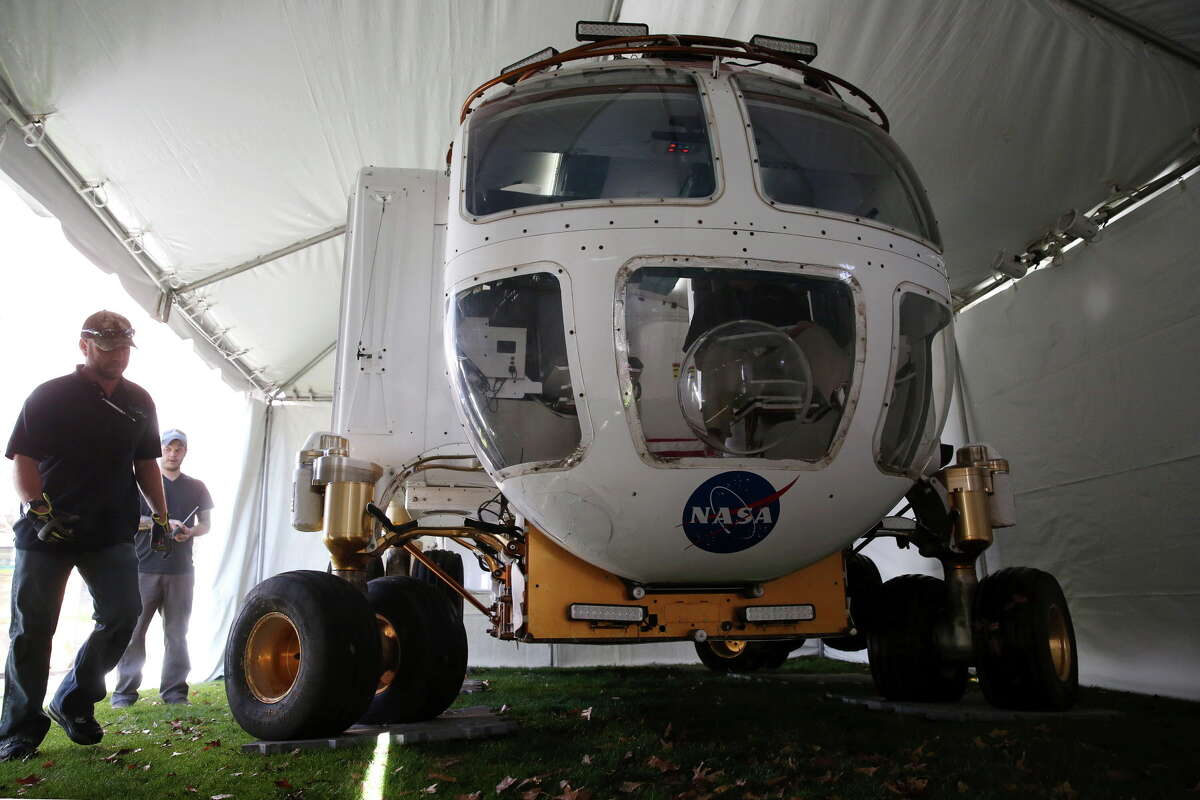 NASA crew members direct a Space Exploration Vehicle moving into a tent at Discover Green Monday, Jan. 23, 2017, in Houston. The space craft was transported from Johnson Space Center to be a part of the Super Bowl LIVE! events that would open this weekend until Super Bowl Sunday.
