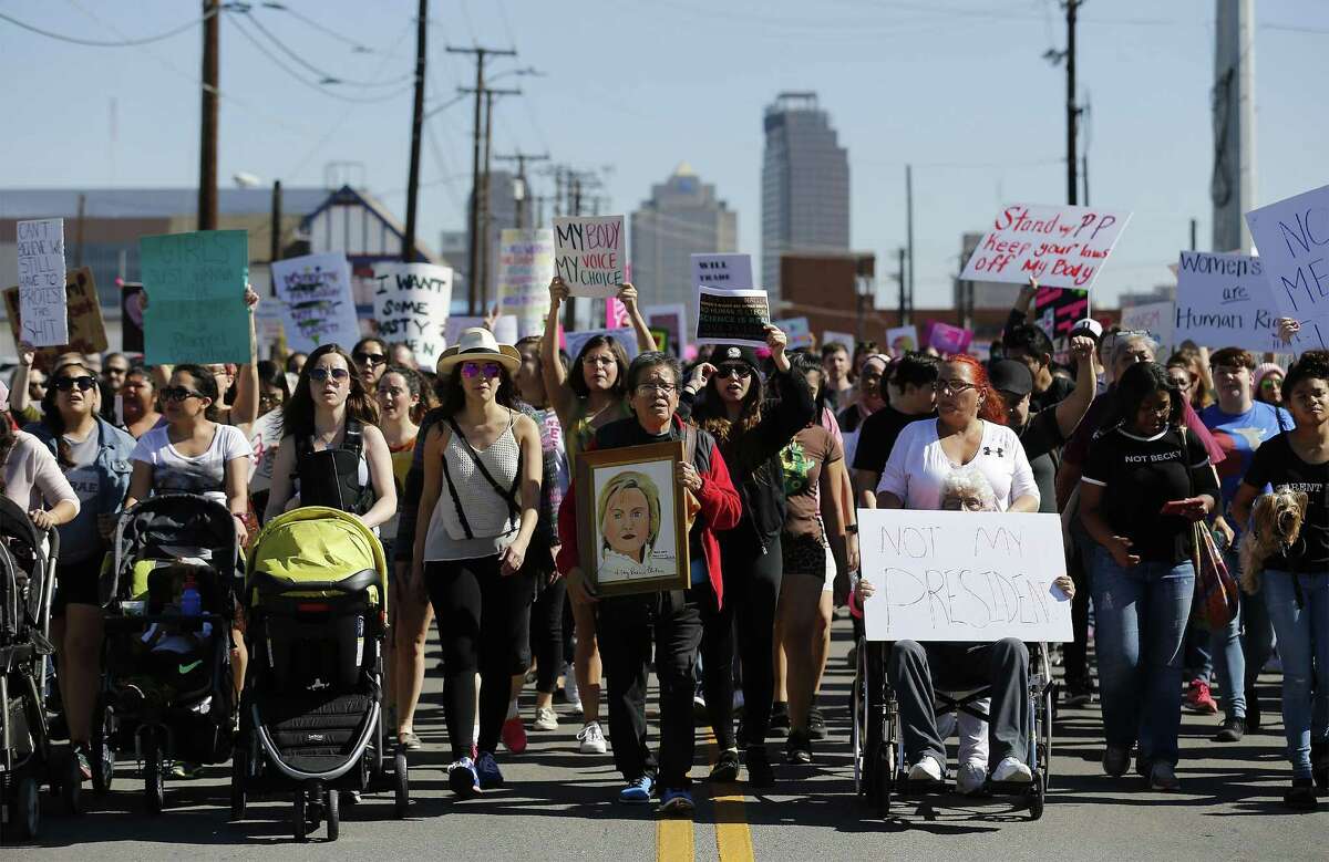 About 1,200-1,500 people gathered at City Hall on Saturday, Jan. 21, 2017 for San Antonio's version of the women's march happening in Washington, D.C. to oppose Donald Trump's inauguration. The march started in downtown and concluded at Estela's Mexican Restaurant on the city's Westside. Advertised as a march against "hate, misogny, transphobia, homophobia, xenophobia," the organizers and protestors railed against Trump's comments against women and minorities. (Kin Man Hui/San Antonio Express-News)