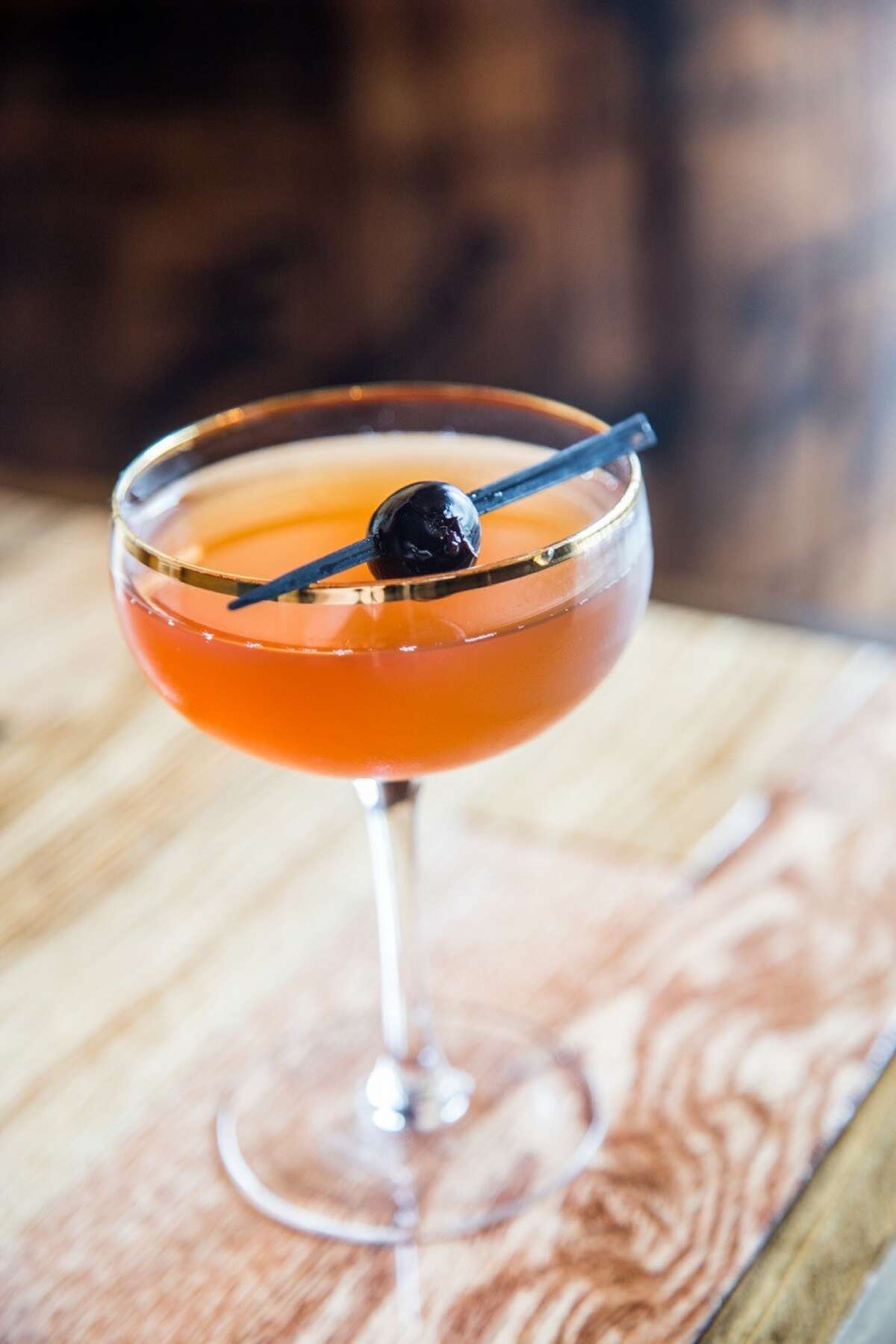 Sweet Bromance is a cocktail made with Suntory Toki whiskey, hibiscus liqueur, port and amaro at Reserve 101 bar in downtown Houston.