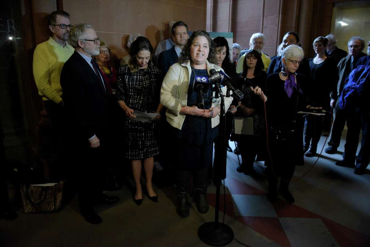 Corinne Carey, center, New York campaign director for Compassion and Choices, addresses those gathered at a press conference to talk about the reintroducing of medical aid in dying legislation at the Capitol on Monday, Jan. 23, 2017, in Albany, N.Y. (Paul Buckowski / Times Union)